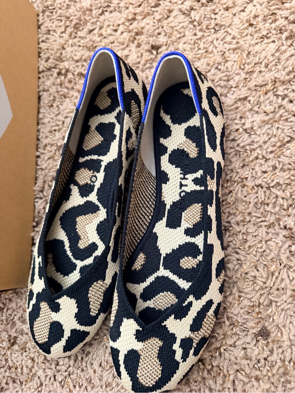 Rothy's Leopard Knit Slip-On Flats in Black and Beige with Blue Trim